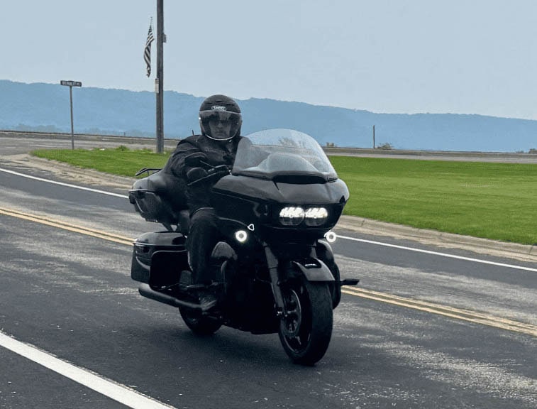 Dcm-Tech Employee On A Motorcycle
