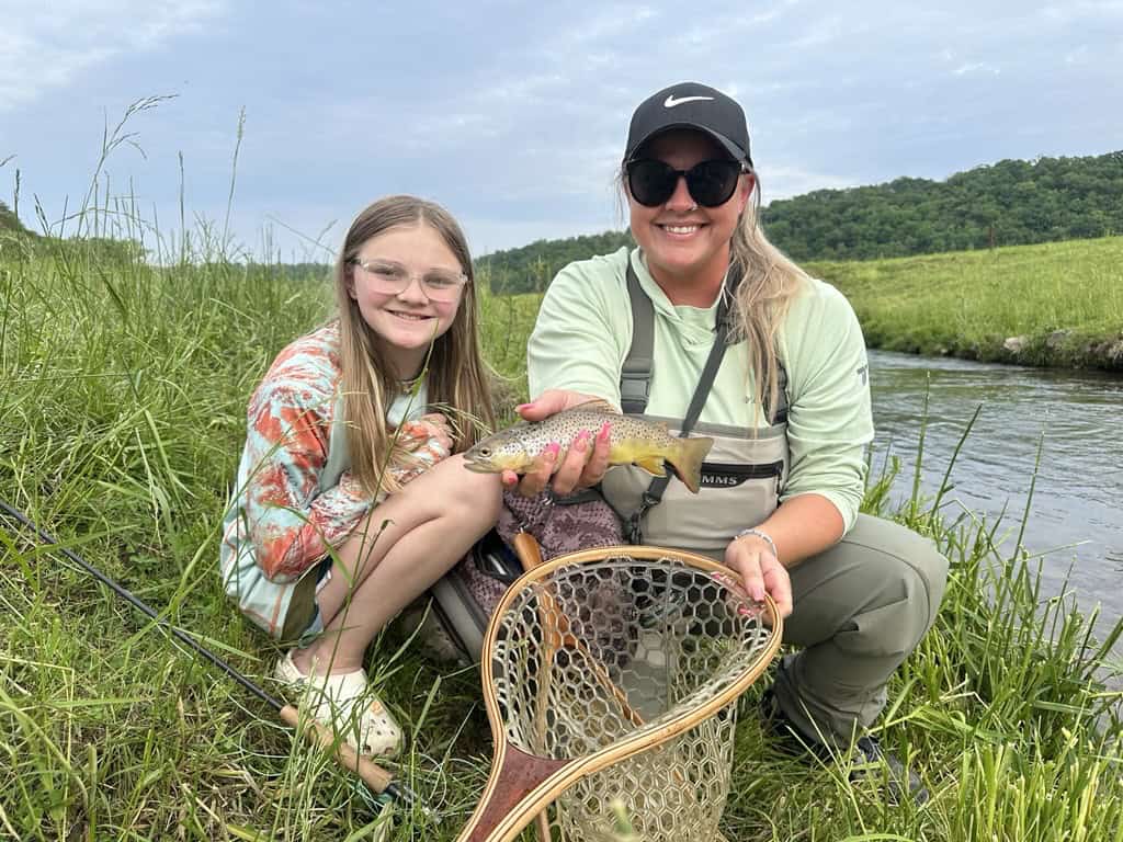 Woman and child with a fish that they caught