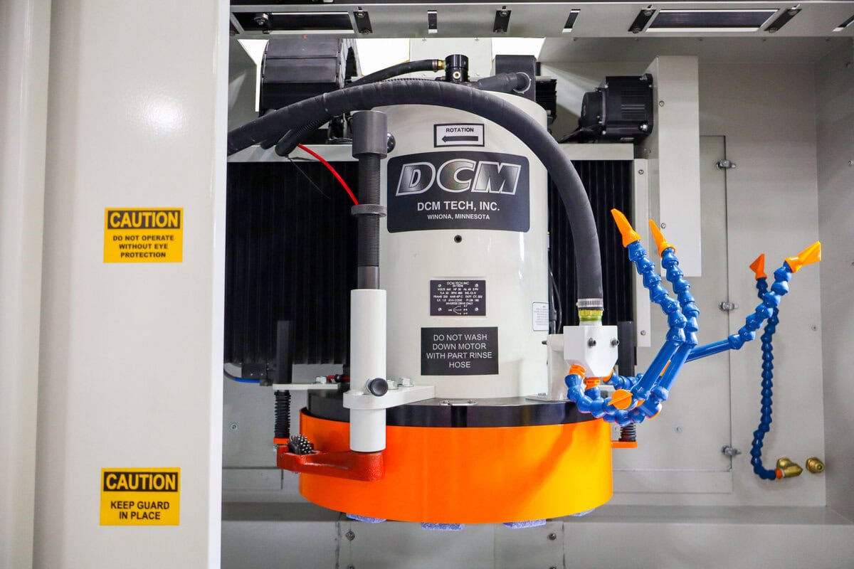 Close-Up Of Dcm Tech Rotary Surface Grinder Grinding Head And Coolant Nozzles