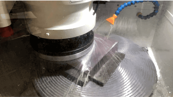Dcm Tech Grinder In Action With Water Spraying On It To Cool