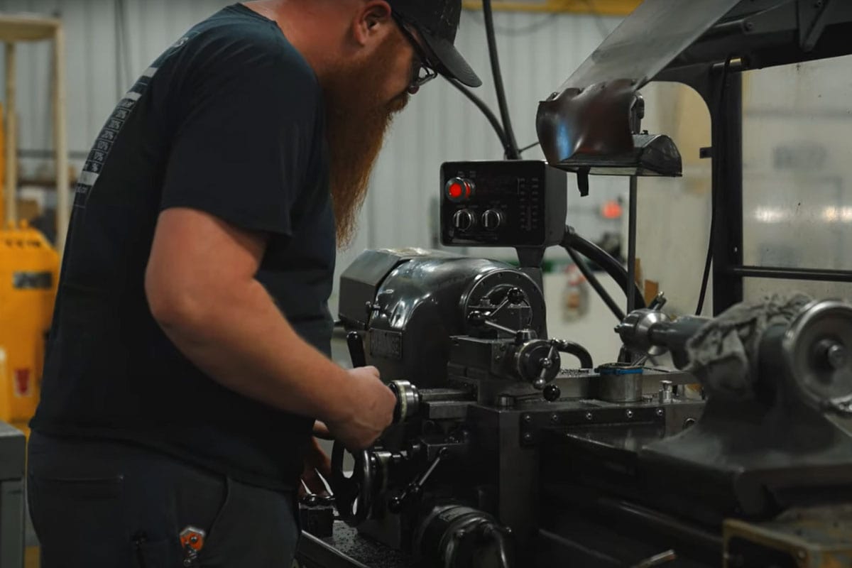 Dcm Tech Employee Operating A Machine