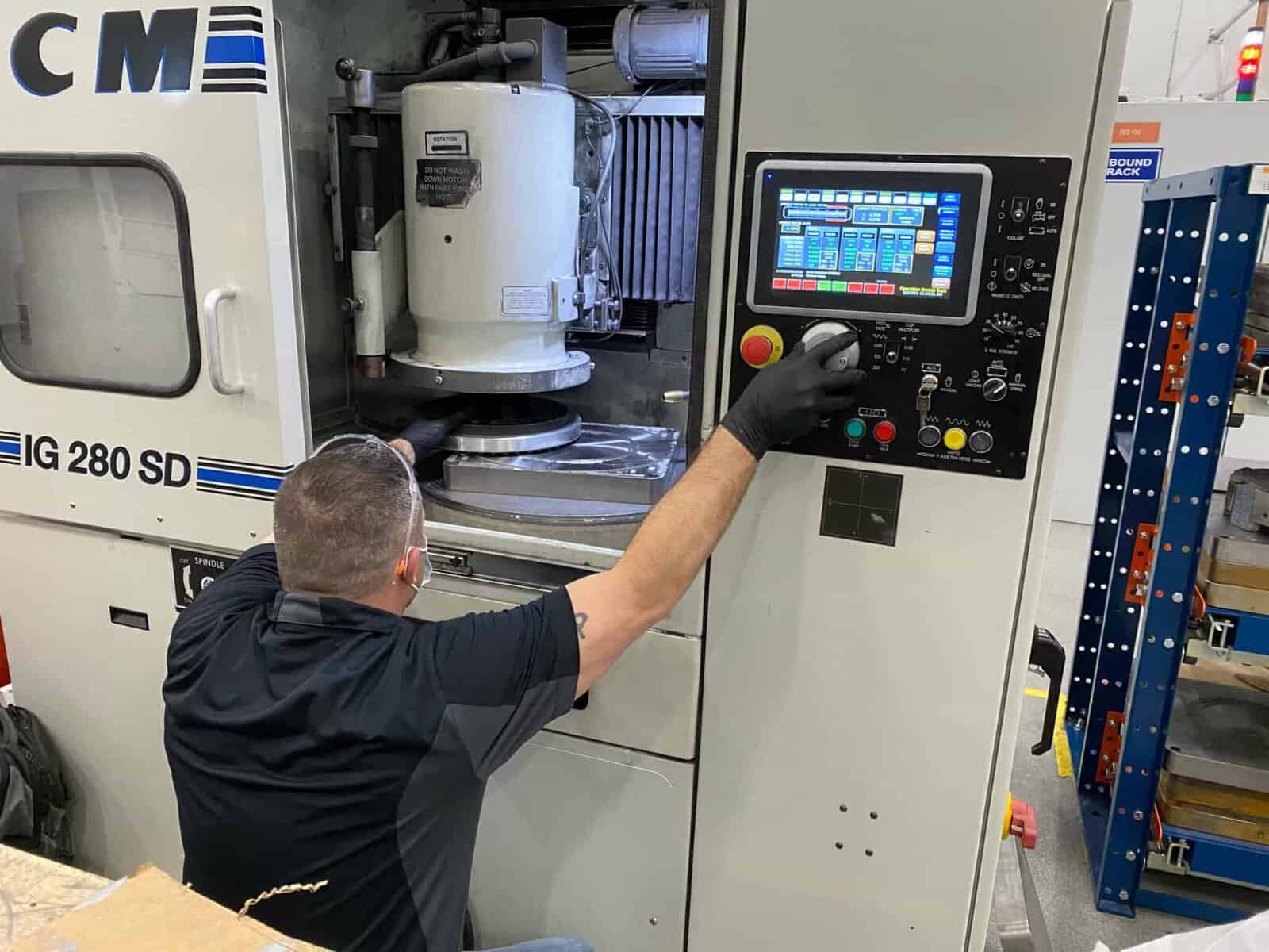 DCM Tech employee operates rotary grinder